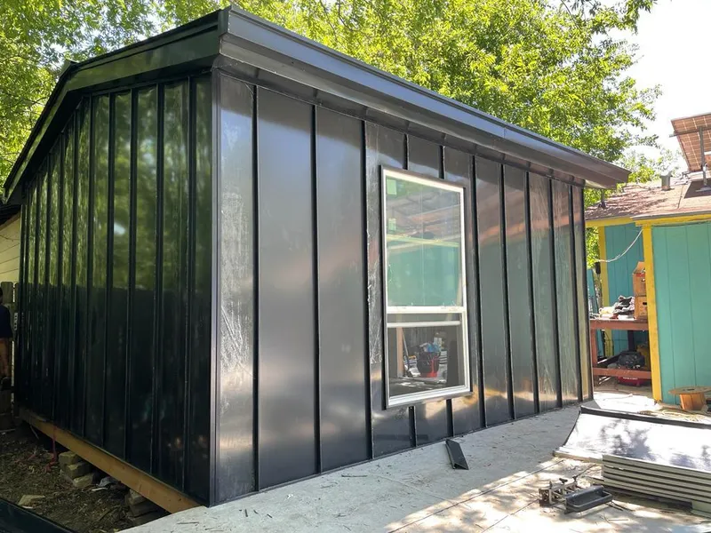 Black standing seam metal wall panels for Roof Inspection in Nebraska City