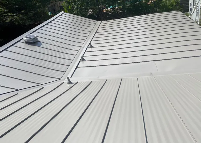 Solar attic fan installed on a metal roof for Roof Ventilation in Nebraska City